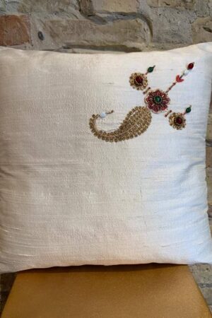 Cushion in white silk with pearl detail