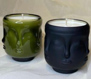 Face candles in glass